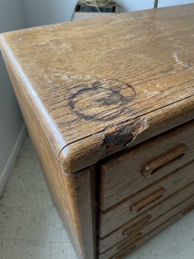 Water ring and chipped veneer on the front corner