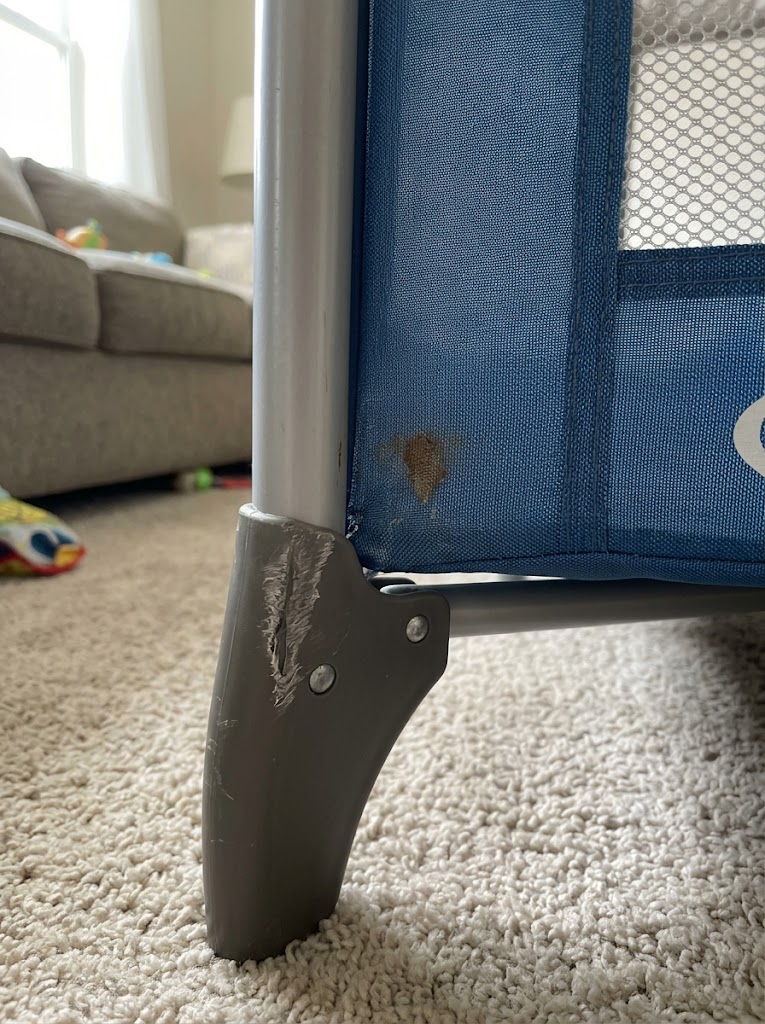 Gouged foot hinge and a stain on the blue mesh